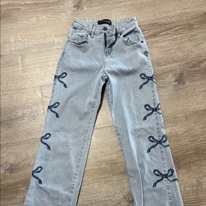 Stylish Jeans with Blue Bow Accents